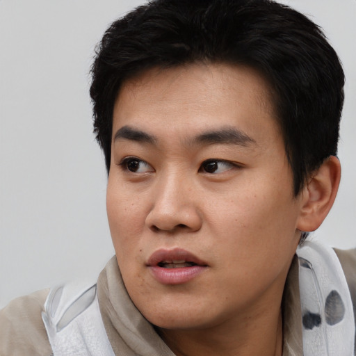 Neutral asian young-adult male with short  black hair and brown eyes