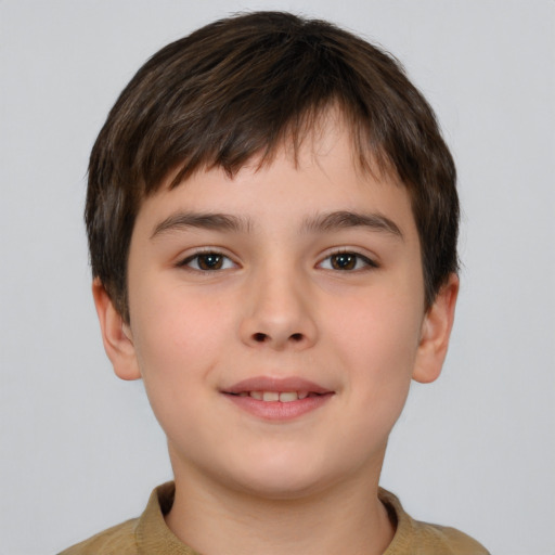 Joyful white child male with short  brown hair and brown eyes