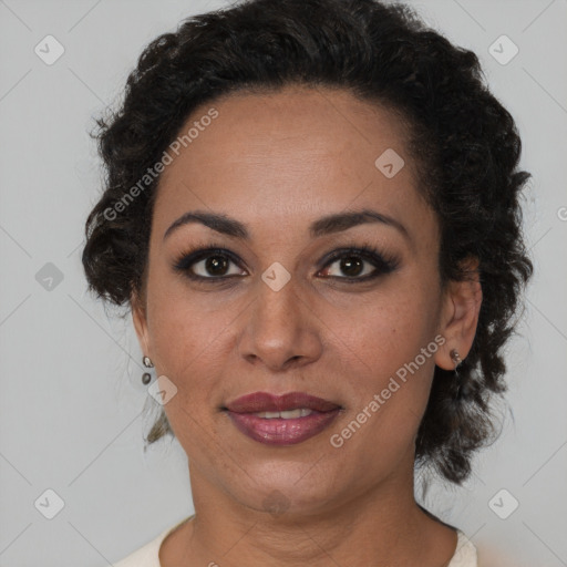 Joyful black adult female with short  brown hair and brown eyes