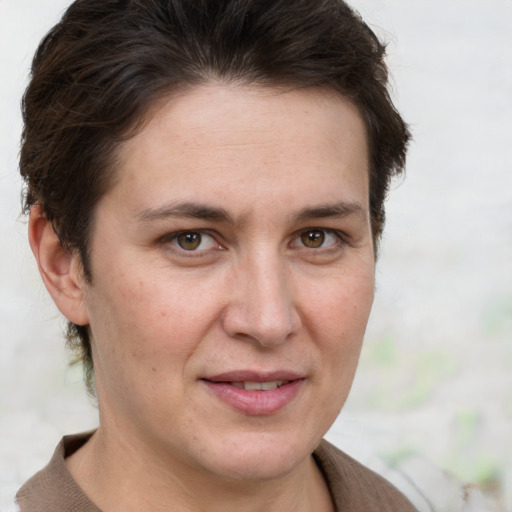 Joyful white adult female with short  brown hair and brown eyes