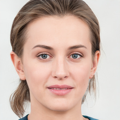 Joyful white young-adult female with medium  brown hair and blue eyes