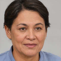 Joyful white adult female with short  brown hair and brown eyes