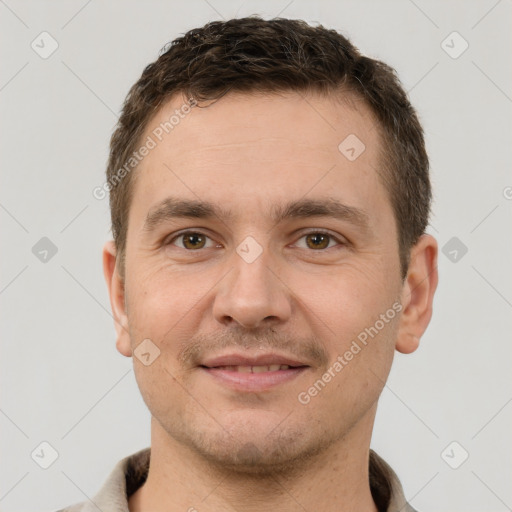 Joyful white young-adult male with short  brown hair and brown eyes