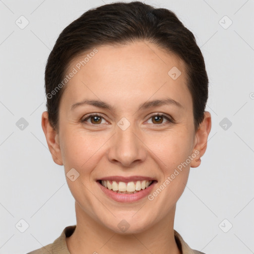 Joyful white young-adult female with short  brown hair and brown eyes