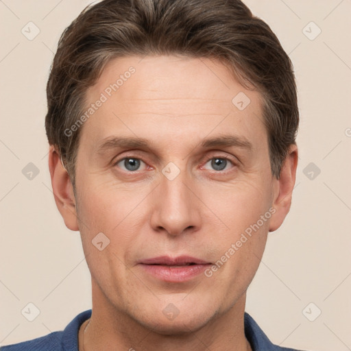 Joyful white adult male with short  brown hair and grey eyes