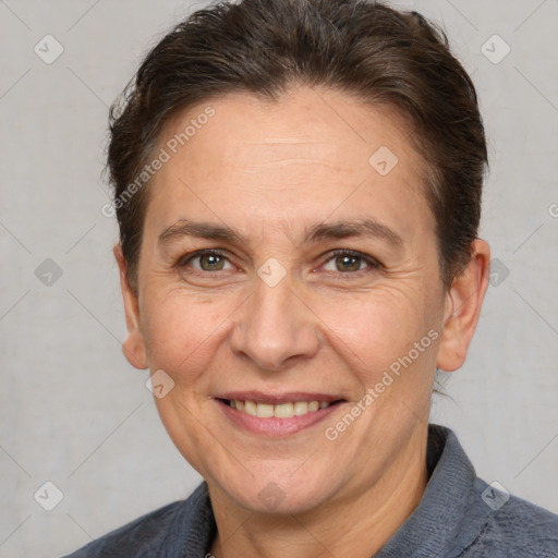 Joyful white adult female with short  brown hair and brown eyes