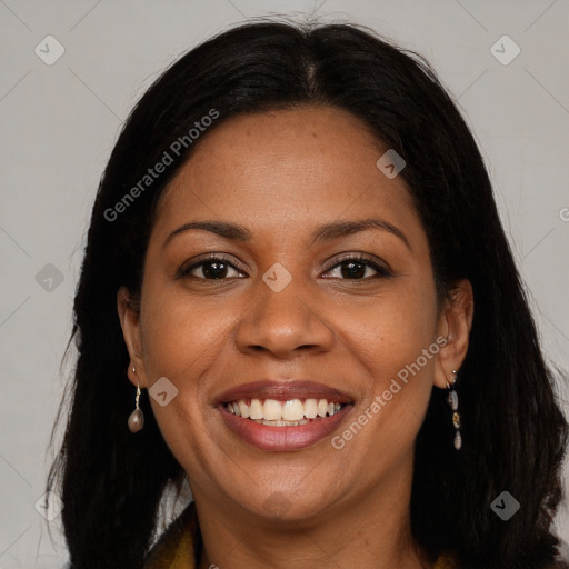 Joyful black young-adult female with long  brown hair and brown eyes