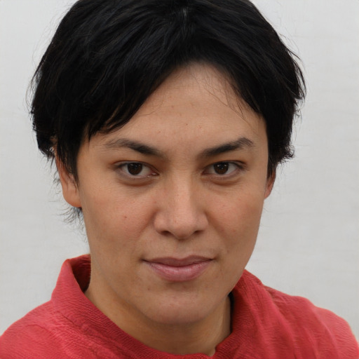 Joyful asian young-adult female with short  brown hair and brown eyes