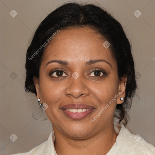 Joyful black adult female with medium  brown hair and brown eyes