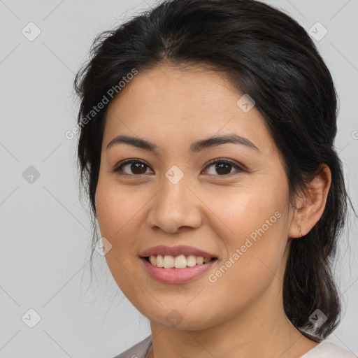 Joyful asian young-adult female with medium  brown hair and brown eyes