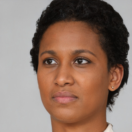 Neutral black young-adult female with short  brown hair and brown eyes