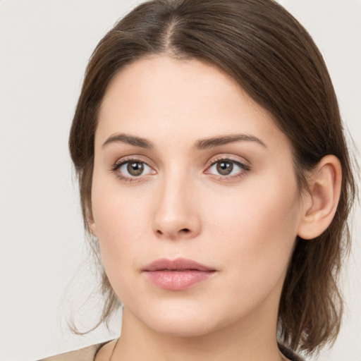 Neutral white young-adult female with medium  brown hair and brown eyes