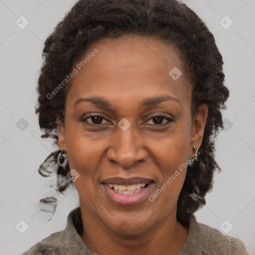 Joyful black adult female with short  brown hair and brown eyes