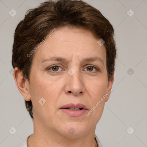 Joyful white adult female with short  brown hair and grey eyes