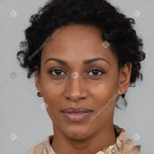 Joyful black adult female with short  brown hair and brown eyes