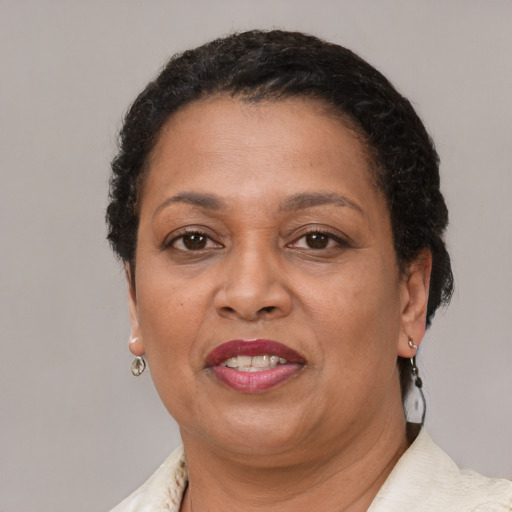 Joyful latino adult female with short  brown hair and brown eyes