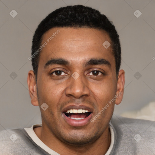 Joyful black young-adult male with short  black hair and brown eyes