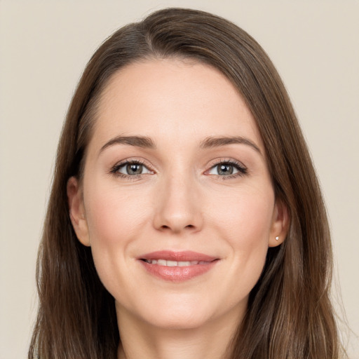 Joyful white young-adult female with long  brown hair and grey eyes