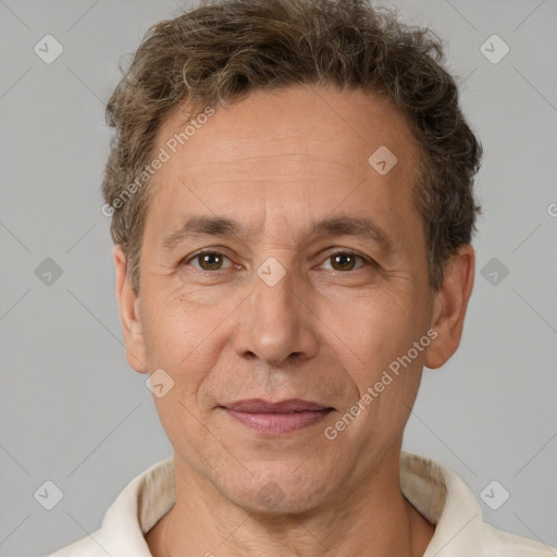 Joyful white middle-aged male with short  brown hair and brown eyes