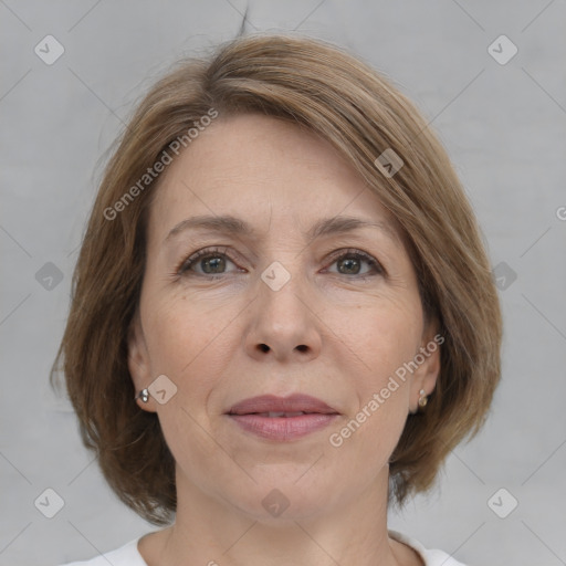 Joyful white adult female with medium  brown hair and grey eyes