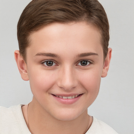 Joyful white child female with short  brown hair and grey eyes