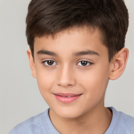 Joyful white child male with short  brown hair and brown eyes