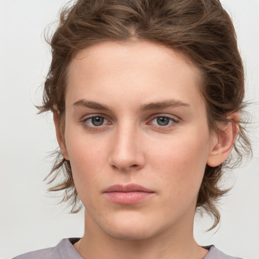 Neutral white young-adult female with medium  brown hair and grey eyes