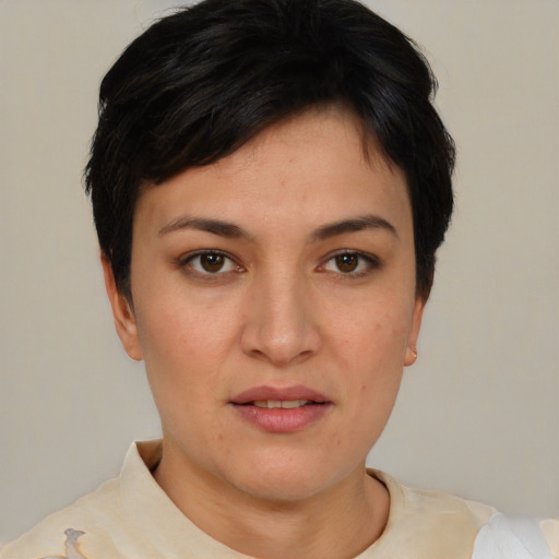 Joyful asian young-adult female with short  brown hair and brown eyes