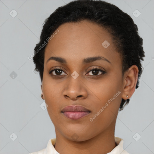 Joyful black young-adult female with short  black hair and brown eyes