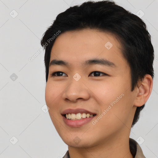 Joyful asian young-adult male with short  black hair and brown eyes