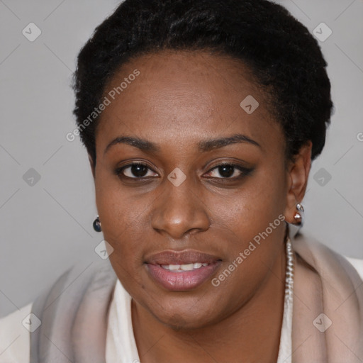 Joyful black young-adult female with short  black hair and brown eyes