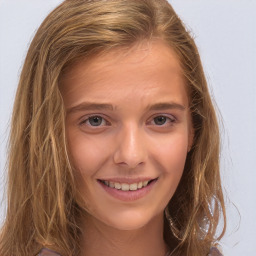 Joyful white child female with long  brown hair and brown eyes