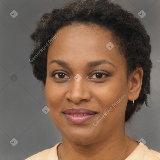 Joyful black adult female with short  brown hair and brown eyes