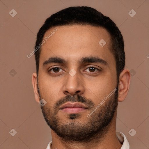 Neutral latino young-adult male with short  black hair and brown eyes