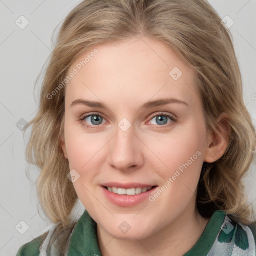 Joyful white young-adult female with medium  brown hair and blue eyes