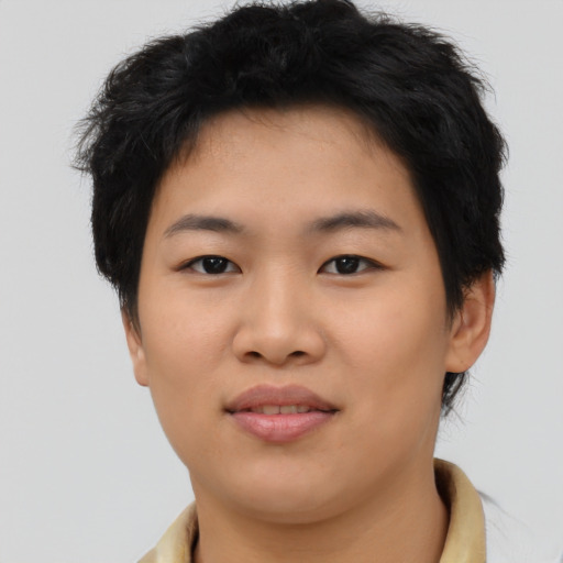 Joyful asian young-adult female with short  brown hair and brown eyes