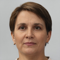 Joyful white adult female with short  brown hair and brown eyes