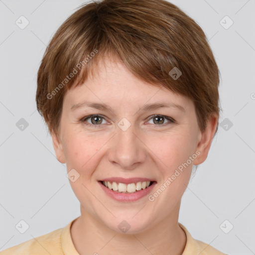 Joyful white young-adult female with short  brown hair and grey eyes