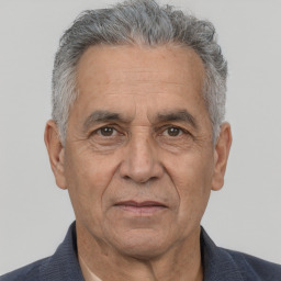 Neutral white middle-aged male with short  gray hair and brown eyes