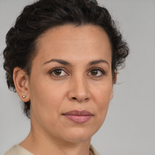 Joyful white adult female with short  brown hair and brown eyes