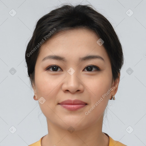 Joyful asian young-adult female with short  brown hair and brown eyes