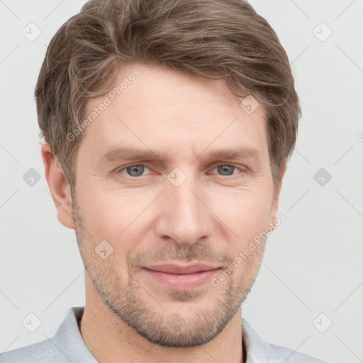 Joyful white adult male with short  brown hair and grey eyes