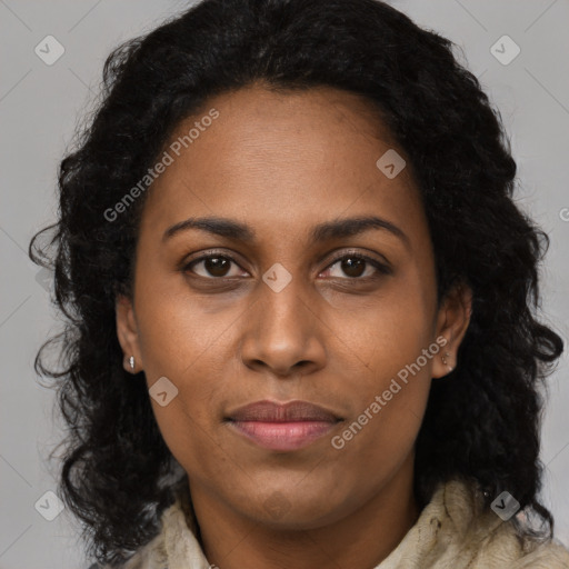 Joyful black young-adult female with long  brown hair and brown eyes