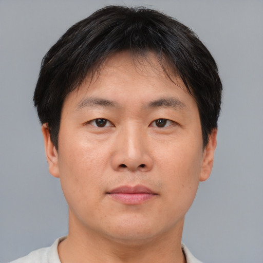 Neutral asian young-adult male with short  brown hair and brown eyes