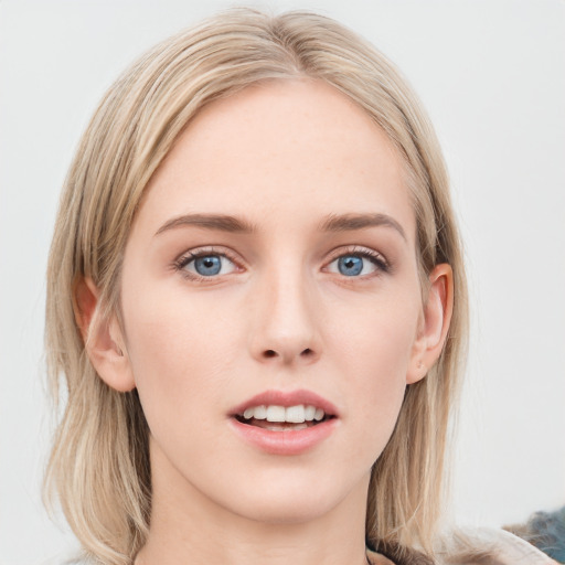 Joyful white young-adult female with medium  brown hair and blue eyes