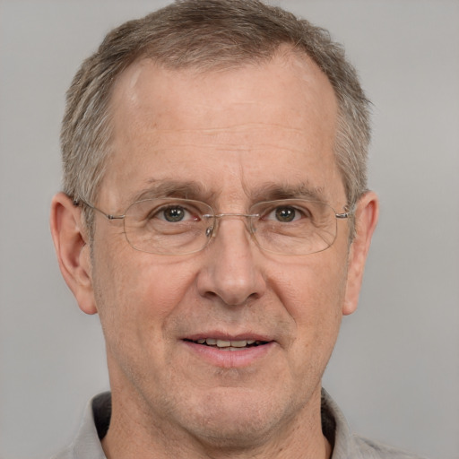 Joyful white middle-aged male with short  gray hair and grey eyes