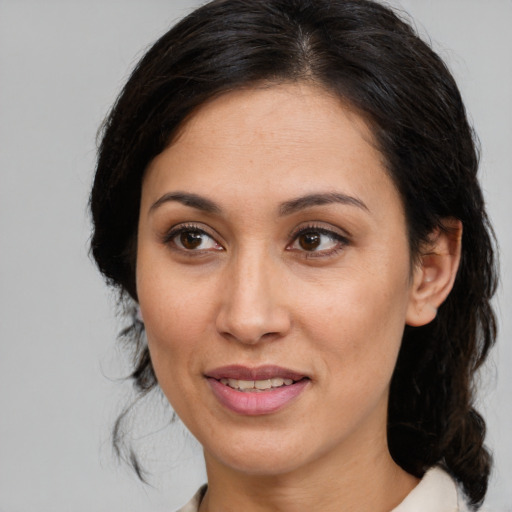 Joyful white adult female with medium  brown hair and brown eyes