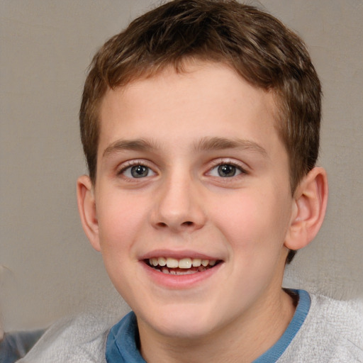 Joyful white child male with short  brown hair and brown eyes