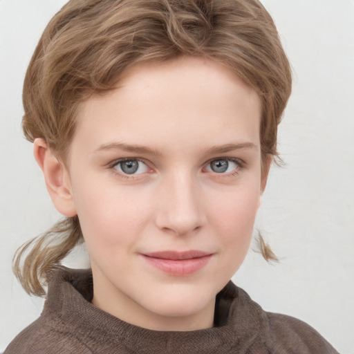 Joyful white child female with medium  brown hair and grey eyes