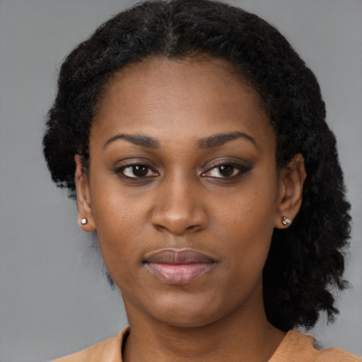 Neutral black young-adult female with medium  black hair and brown eyes